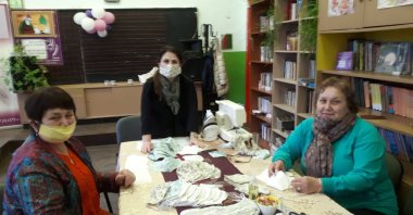 Three women sew masks for the needy in the town of Dobric, Wednesday, March 25, 2020. (DHA Photo)