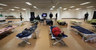 Homeless people sleep inside the Festival palace in France, Tuesday, March 24, 2020. (Reuters Photo)