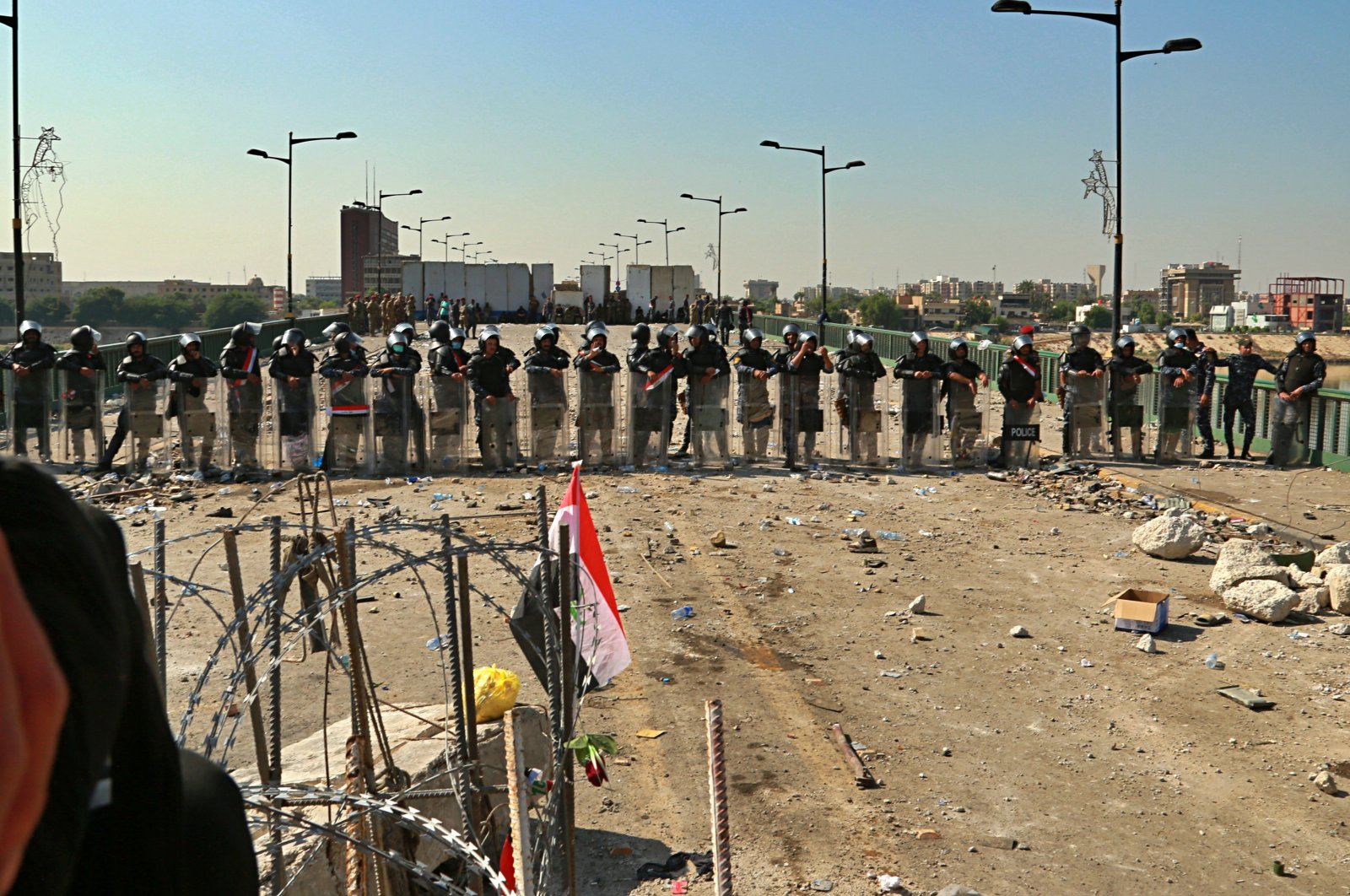 Security forces close the bridge leading to the Green Zone during a demonstration in Baghdad, Iraq, Oct. 26, 2019. (AP Photo)