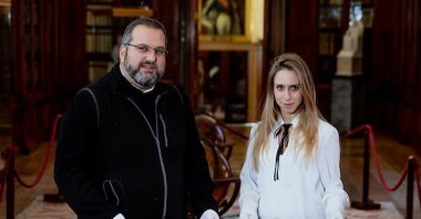 Serafino Jamourlian (L) of the monastery and Vittoria Dall'Armellina with a newly rediscovered 5,000-year-old sword. (Courtesy of Ca' Foscari University of Venice)