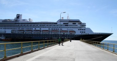 The Zaandam ship cruise, sailing under the Dutch flag and operated by the Holland America (Carnival) group, with 1,800 people on board, is seen in Punta Arenas, in southern Chile, on March 16, 2020. (AFP Photo)