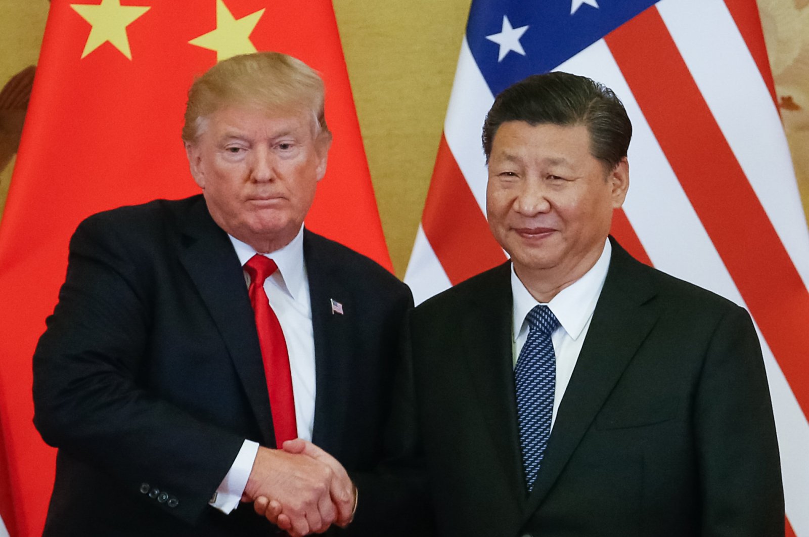 U.S. President Donald Trump (L) and Chinese President Xi Jinping (R) shake hands during a news conference at the Great Hall of the People (GHOP) in Beijing, China, Nov. 9, 2017. (EPA Photo)