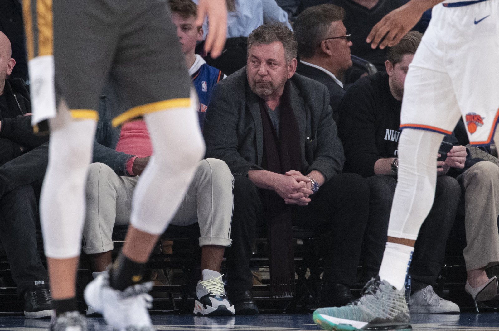 New York Knicks owner James Dolan (C) watches the first half of an NBA basketball game in New York, U.S.,  March 6, 2020. (AP Photo)