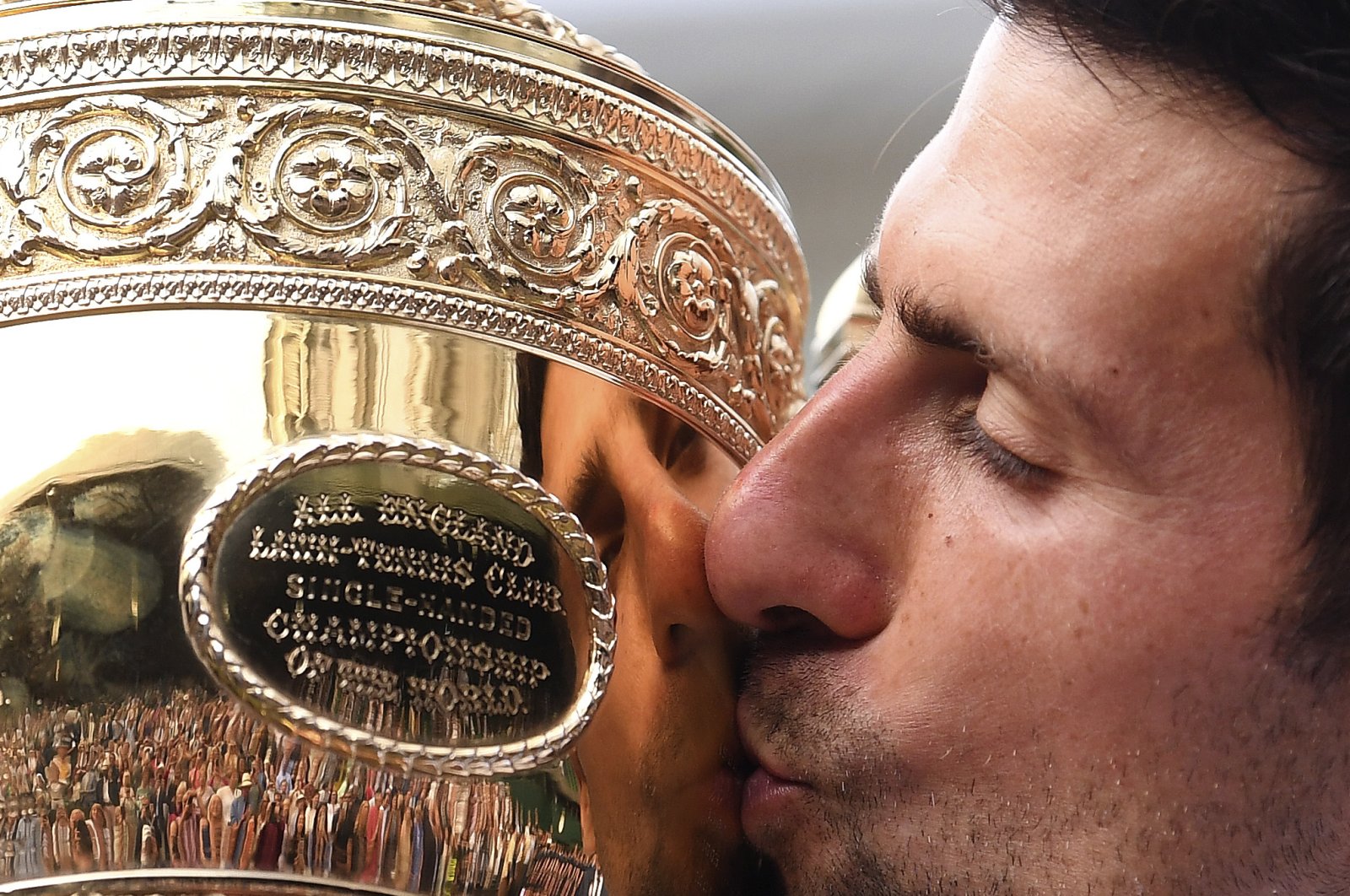 Novak Djokovic kisses the trophy after winning the Wimbledon Tennis Championships, London, U.K., July 14, 2019. (AP Photo)