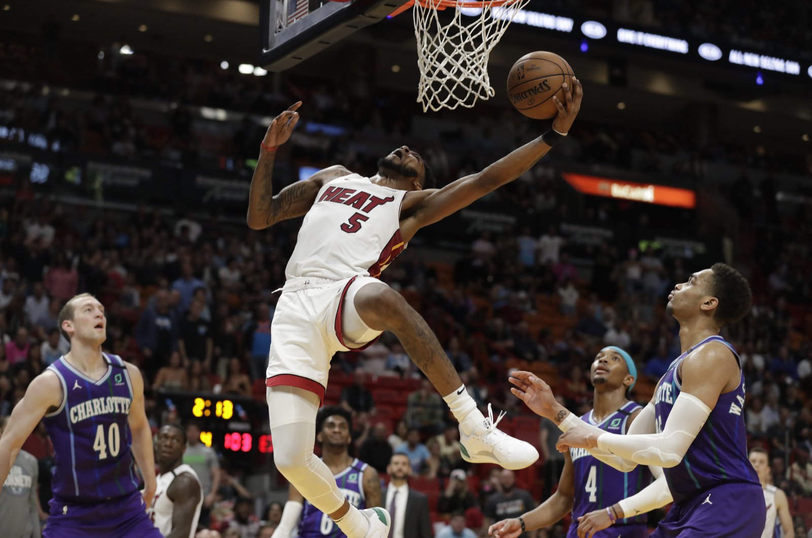Miami Heat forward Derrick Jones Jr. (5) goes up for a shot during the second half of an NBA basketball game against the Charlotte Hornets, in Miami, March 11, 2020. (AP Photo)