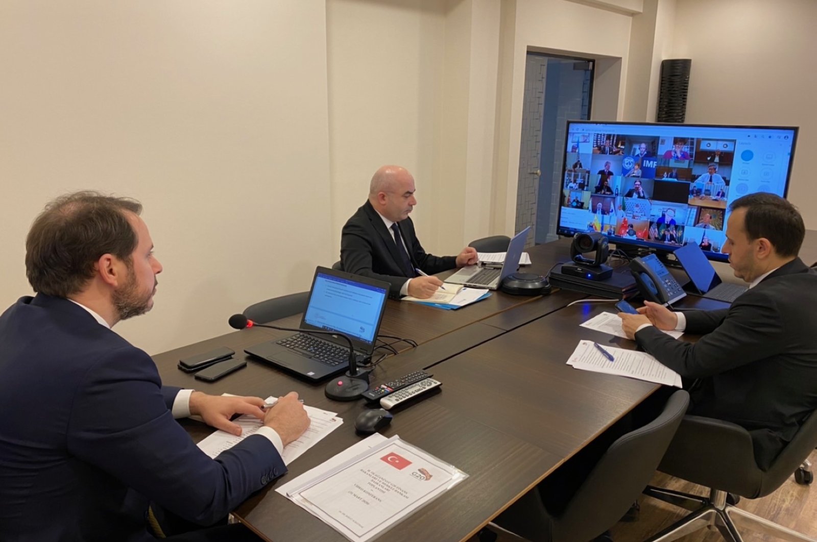 Treasury and Finance Minister Berat Albayrak (L) and Central Bank of the Republic of Turkey Gov. Murat Uysal (2nd L) attend a virtual meeting of the G-20 finance ministers and central bank governors, Tuesday, March 31, 2020. (Photo from Twitter @BeratAlbayrak)