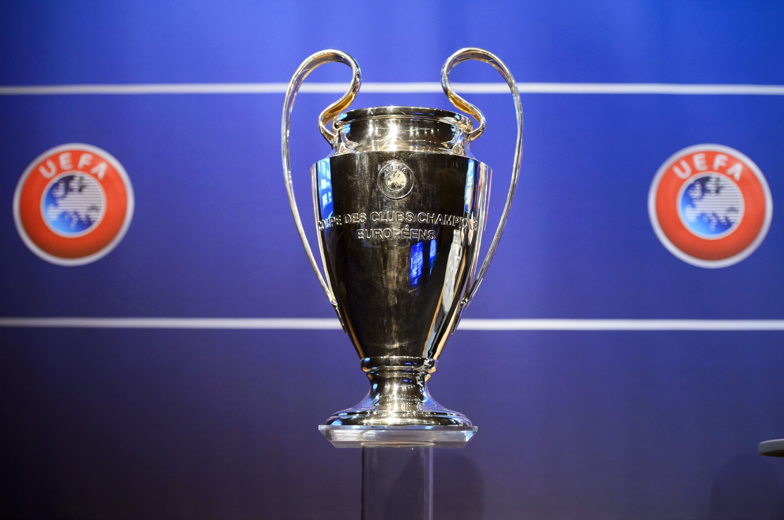 The Champions League trophy on display during the draw of the first two qualifying rounds of the UEFA Champions League 2014/15 at the UEFA Headquarters in Nyon, Switzerland, 23 June 2014 (re-issued on 23 March 2020). (EPA Photo)