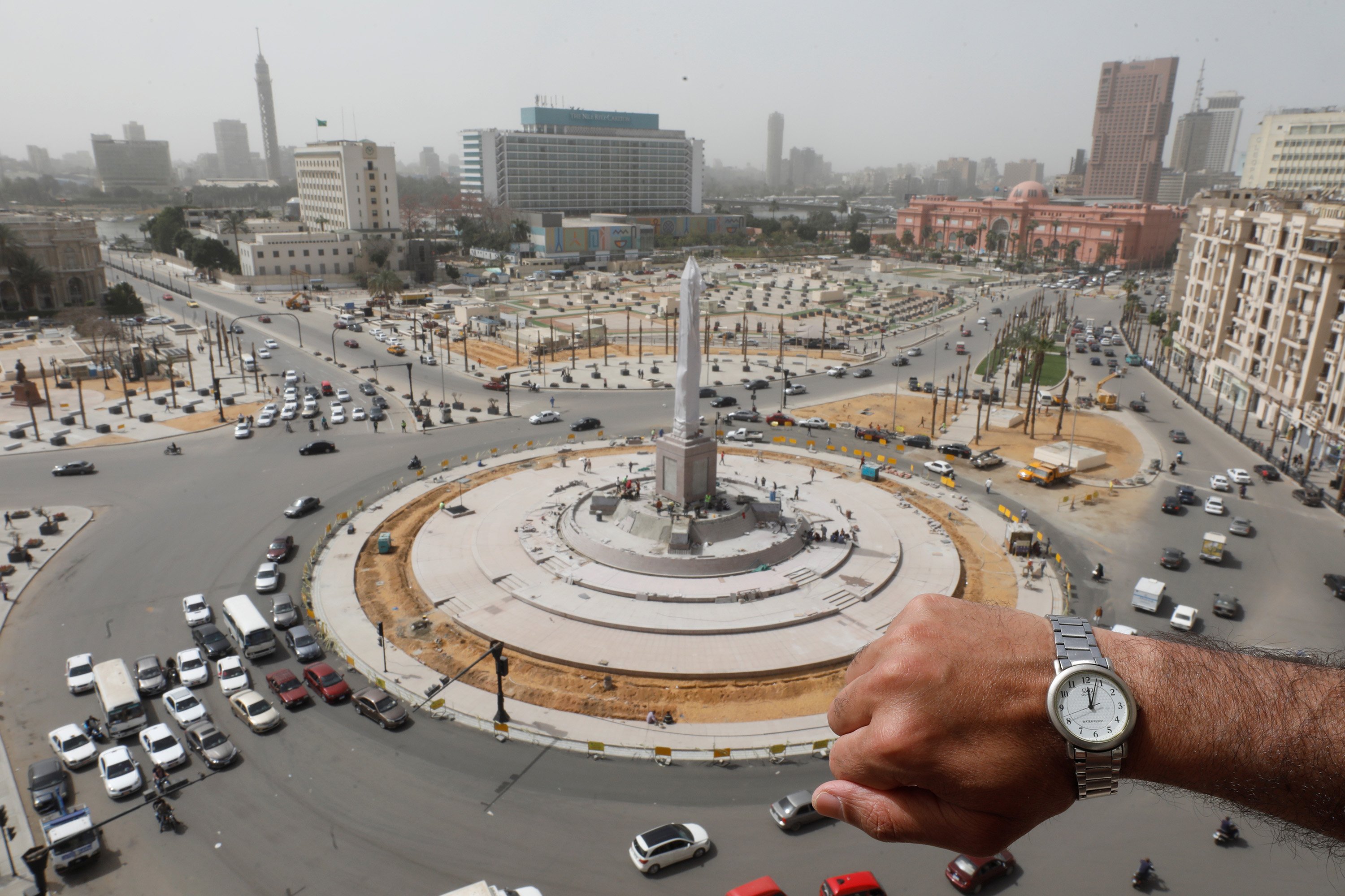 A watch showing the time at noon in front of Tahrir Square, in Cairo, Egypt, March 31, 2020. (Reuters Photo)