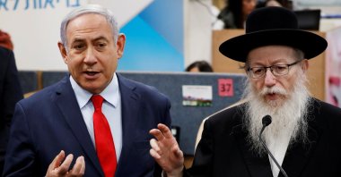 Israeli Prime Minister Benjamin Netanyahu (L) and Health Minister Yaakov Litzman gesture as they deliver statements during a visit to the Health Ministry national hotline, in Kiryat Malachi, Israel, March 1, 2020. (Reuters Photo)