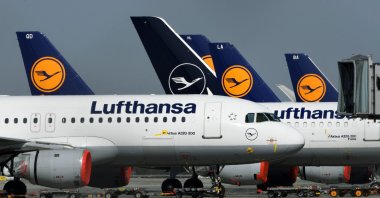 Planes of German airline Lufthansa are parked at the "Franz-Josef-Strauss" airport in Munich, southern Germany, March 27, 2020. (AFP Photo)