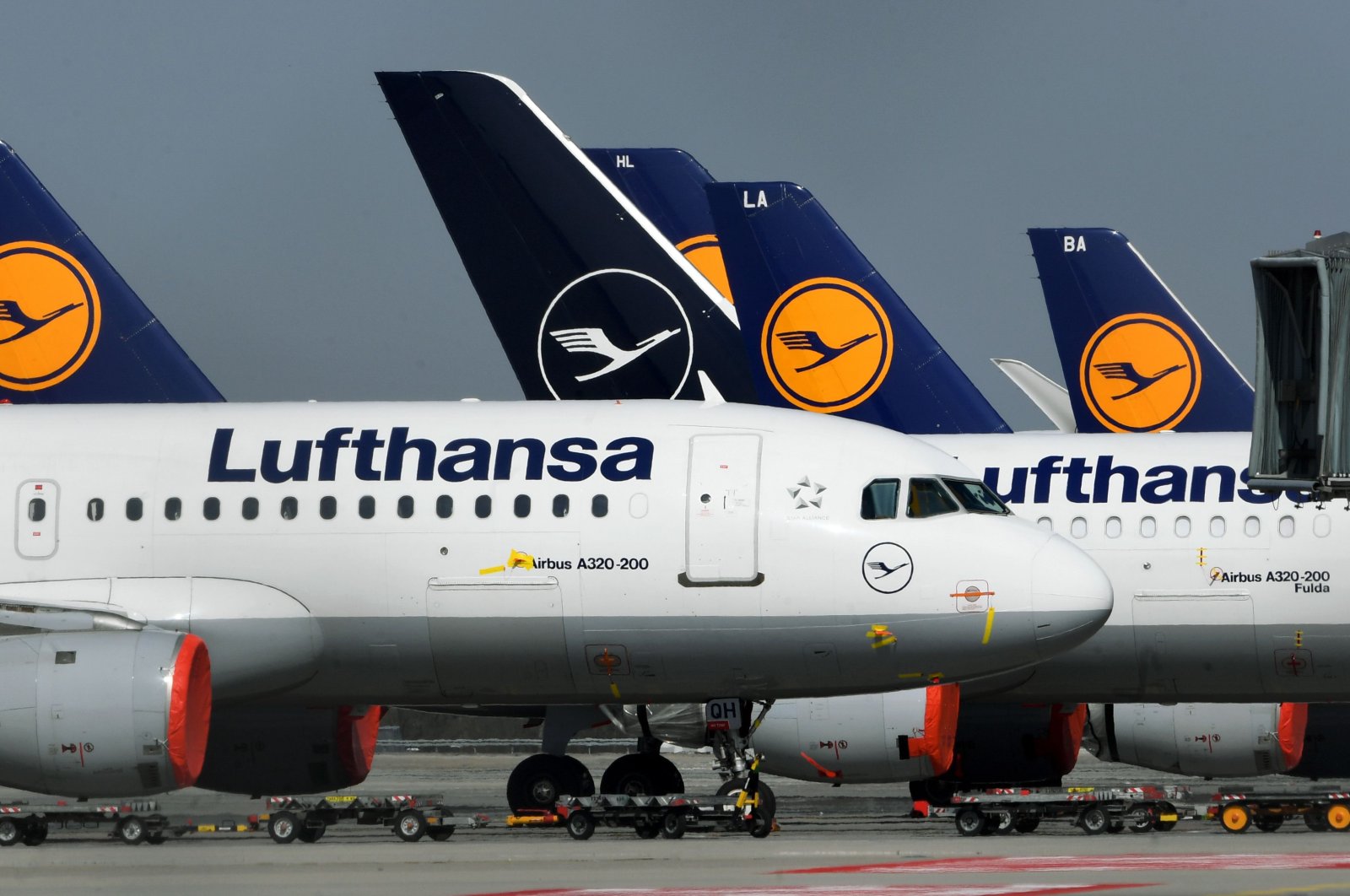Planes of German airline Lufthansa are parked at the "Franz-Josef-Strauss" airport in Munich, southern Germany, March 27, 2020. (AFP Photo)