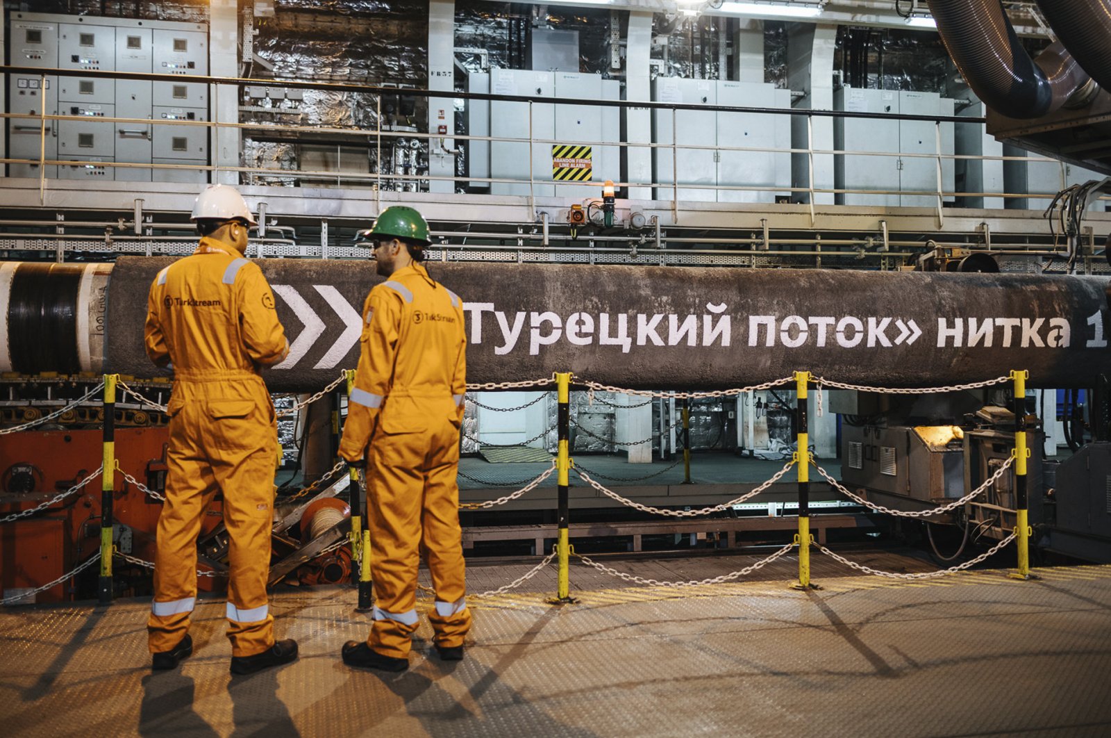 This file photo shows workers in front of pipes to be laid on the Black Sea seabed by the vessel Pioneering Spirit as part of the TurkStream gas pipeline project, Feb. 5, 2018. (AA Photo)

