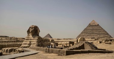 The Giza pyramids necropolis on the southwestern outskirts of the Egyptian capital Cairo is pictured empty after the site closed to the general public as a protective measure against the spread of the coronavirus COVID-19 on March 25, 2020. (AFP Photo)