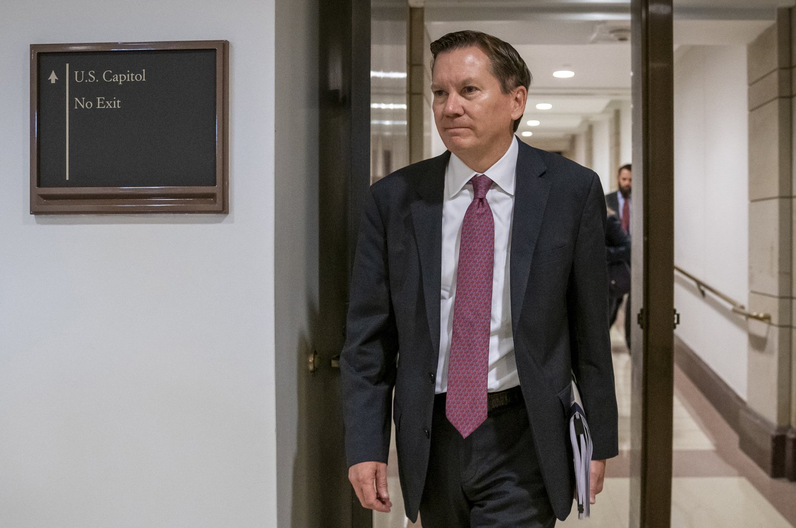 In this file photo, Michael Atkinson, the inspector general of the intelligence community, arrives at the Capitol in Washington for closed-door questioning about a whistleblower complaint that triggered President Donald Trump's impeachment, Washington D.C., Oct. 4, 2019. (AP Photo)
