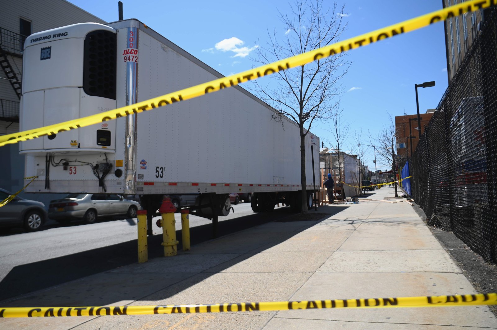 In this file photo taken on April 02, 2020, refrigerated trailers are parked outside of the Wyckoff Heights Medical Center in Brooklyn on April 02, 2020, in New York. (AFP Photo)