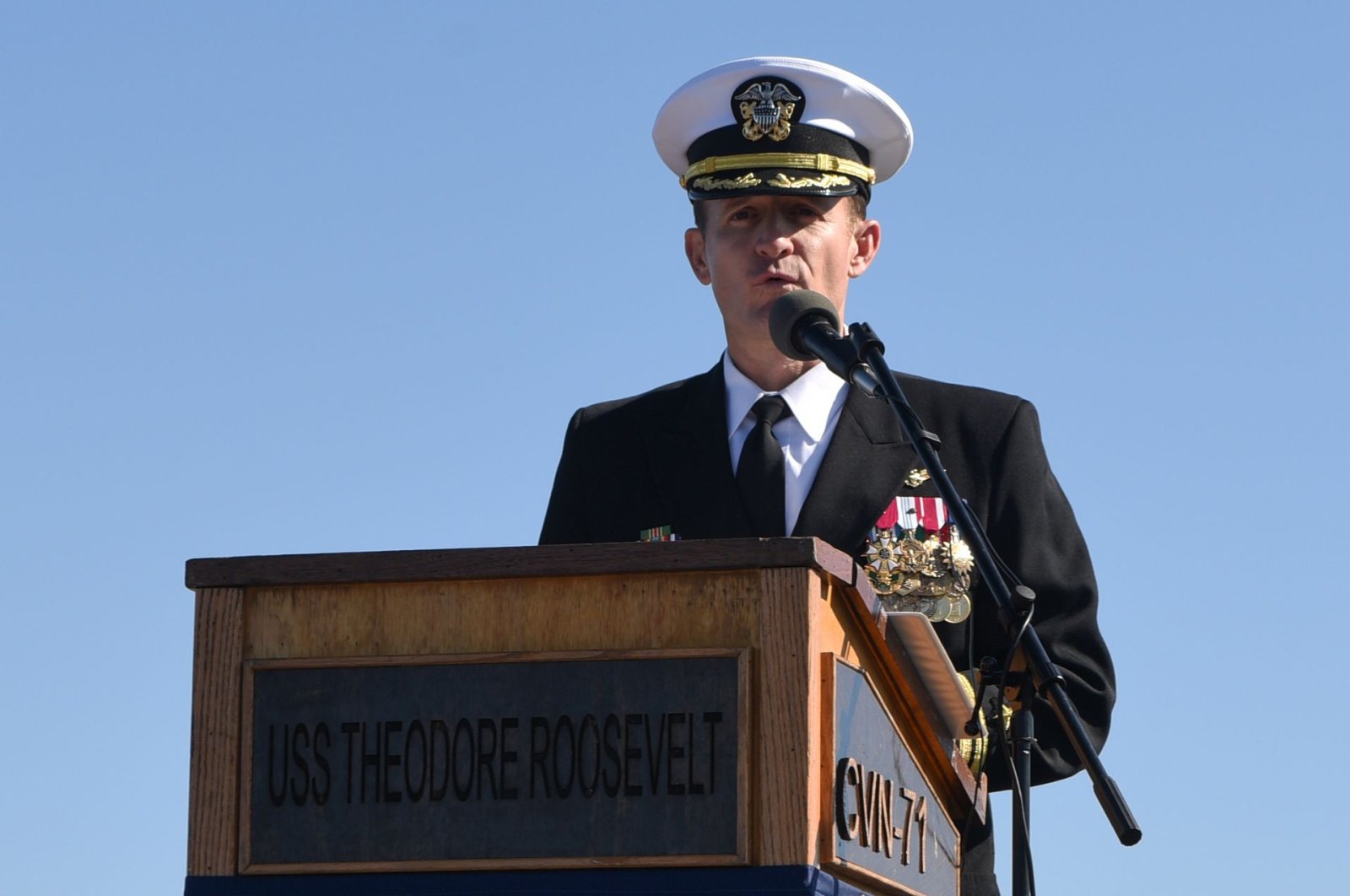 This handout photo released by the U.S. Navy shows Capt. Brett Crozier addressing the crew for the first time as commanding officer of the aircraft carrier USS Theodore Roosevelt (CVN 71) during a change of command ceremony on the ship’s flight deck in San Diego, California, Nov. 1, 2019. (AFP Photo)
