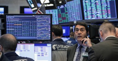 Traders work on the floor of the New York Stock Exchange in New York, U.S., March 20, 2020.