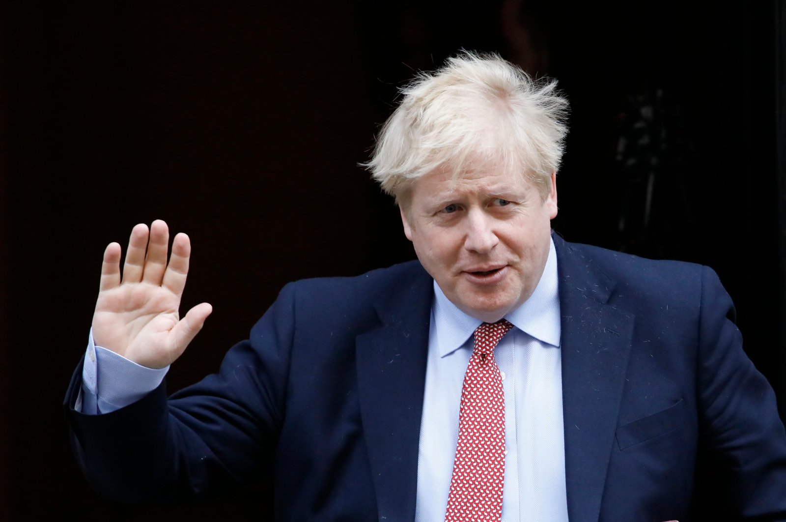 Britain's Prime Minister Boris Johnson leaves No. 10 Downing Street in central London on his way to the House of Commons to attend Prime Minister's Questions, Wednesday, March 25, 2020. (AFP Photo)