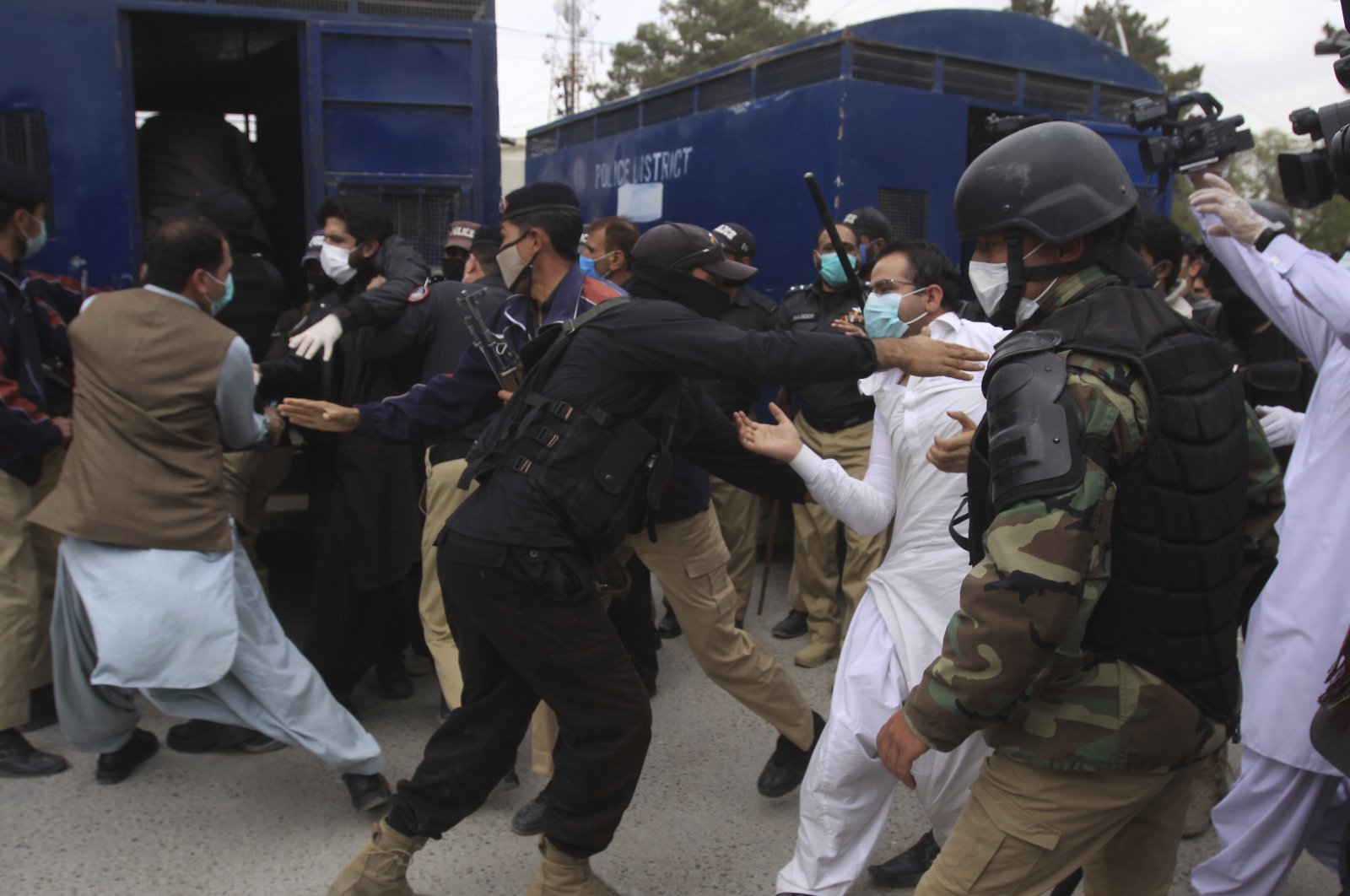 Police arrest doctors demanding facilities and prevention kits to attend coronavirus patients, Quetta, Pakistan, Monday, April 6, 2020. (AP Photo)
