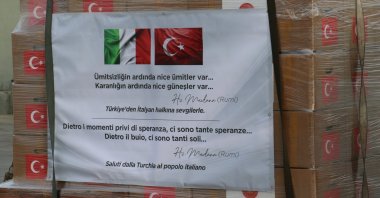 "There is hope after despair and many suns after darkness," a quote by the 13th-century Sufi mystic Mevlana Jalaluddin Rumi, is seen on a coronavirus aid package prepared by Turkish authorities to be delivered to Italy to help combat the pandemic, Ankara, Turkey, Wednesday, April 1, 2020. (İHA Photo)