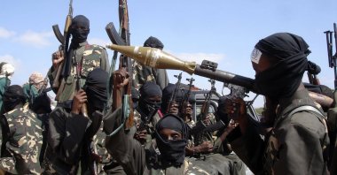 Armed Al-shabab militants on pickup trucks prepare to travel into the city, just outside Mogadishu, in Somalia, Dec. 8, 2008. (AP Photo)