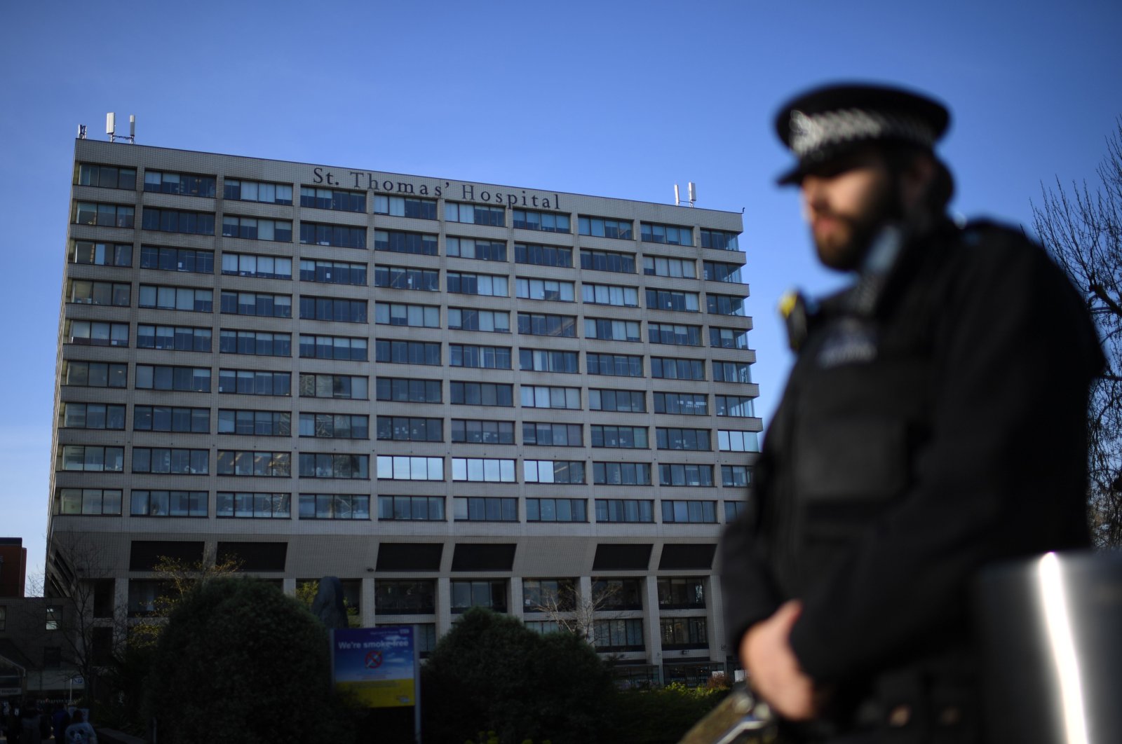 A police officer stands guard at St Thomas' Hospital in central London, U.K., where Britain's Prime Minister Boris Johnson is in intensive care, Tuesday, April 7, 2020. (AFP Photo)