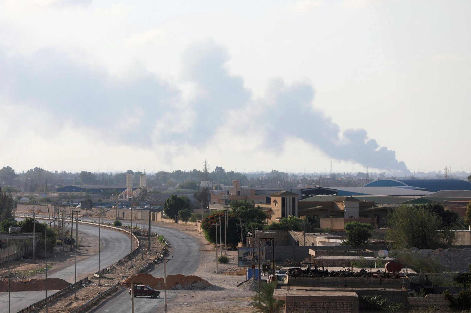 Smoke rises during clashes between forces allied to the internationally recognized government and armed groups in Tripoli, Libya, Sept. 22, 2018. (REUTERS Photo)
