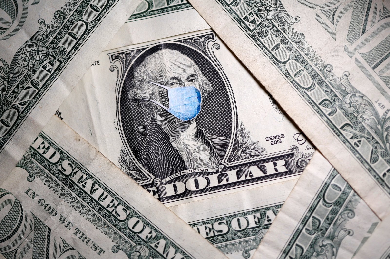 George Washington is seen with printed medical mask on the one dollar banknote in this illustration taken, March 31, 2020. (Reuters Photo)