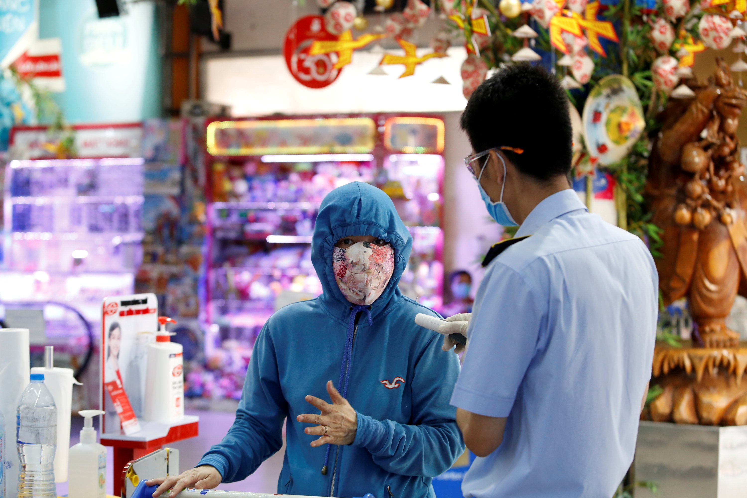 A man has his temperature check at a supermarket entrance in Ho Chi Minh, Vietnam, April 4, 2020. (Reuters Photo)