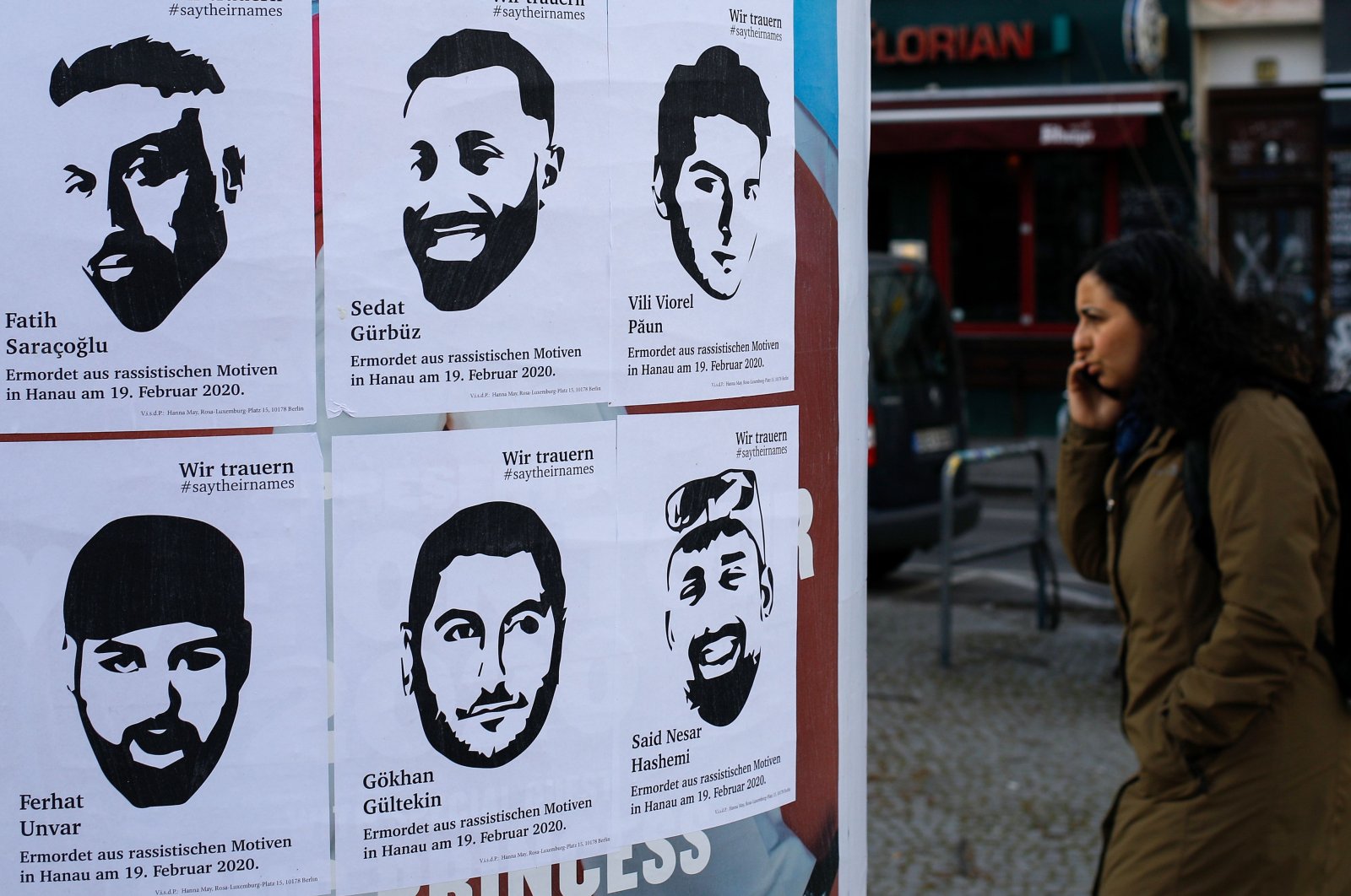 Posters with the pictures and names of victims of a far-right extremist gunman who killed nine people in a racist attack in Hanau, Germany on Feb. 19 can be seen on an advertising column in Berlin's Kreuzberg district, Germany, March 19, 2020. (AFP Photo)