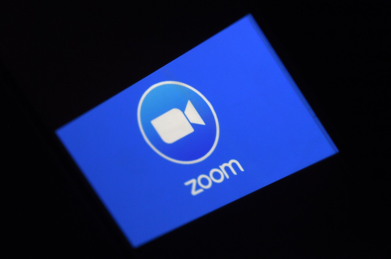 In this file photo illustration taken Monday, March 30, 2020, a Zoom App logo is displayed on a smartphone in Arlington, Virginia, U.S. (AFP Photo)
