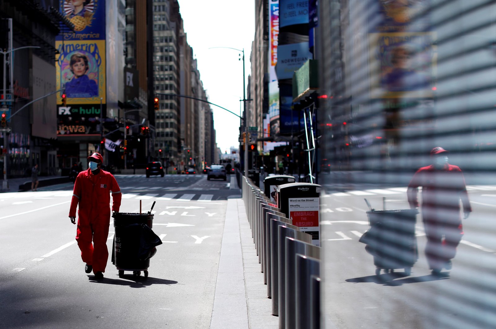 A Times Square Alliance street sweeper walks through a nearly empty Times Square in Manhattan during the outbreak of the coronavirus in New York City, New York, U.S., Tuesday, April 7, 2020. (Reuters Photo)
