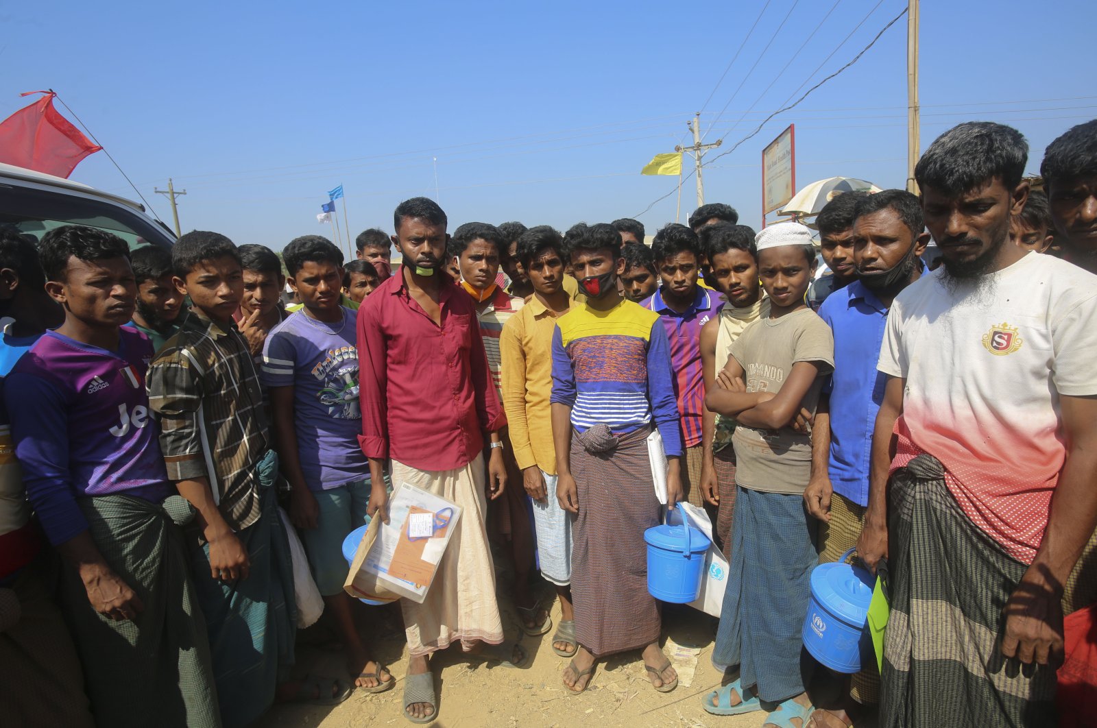 Rohingya refugees stand in the Kutupalong refugee camp, Cox’s Bazar, Bangladesh, Wednesday, April 1, 2020. (AP Photo)