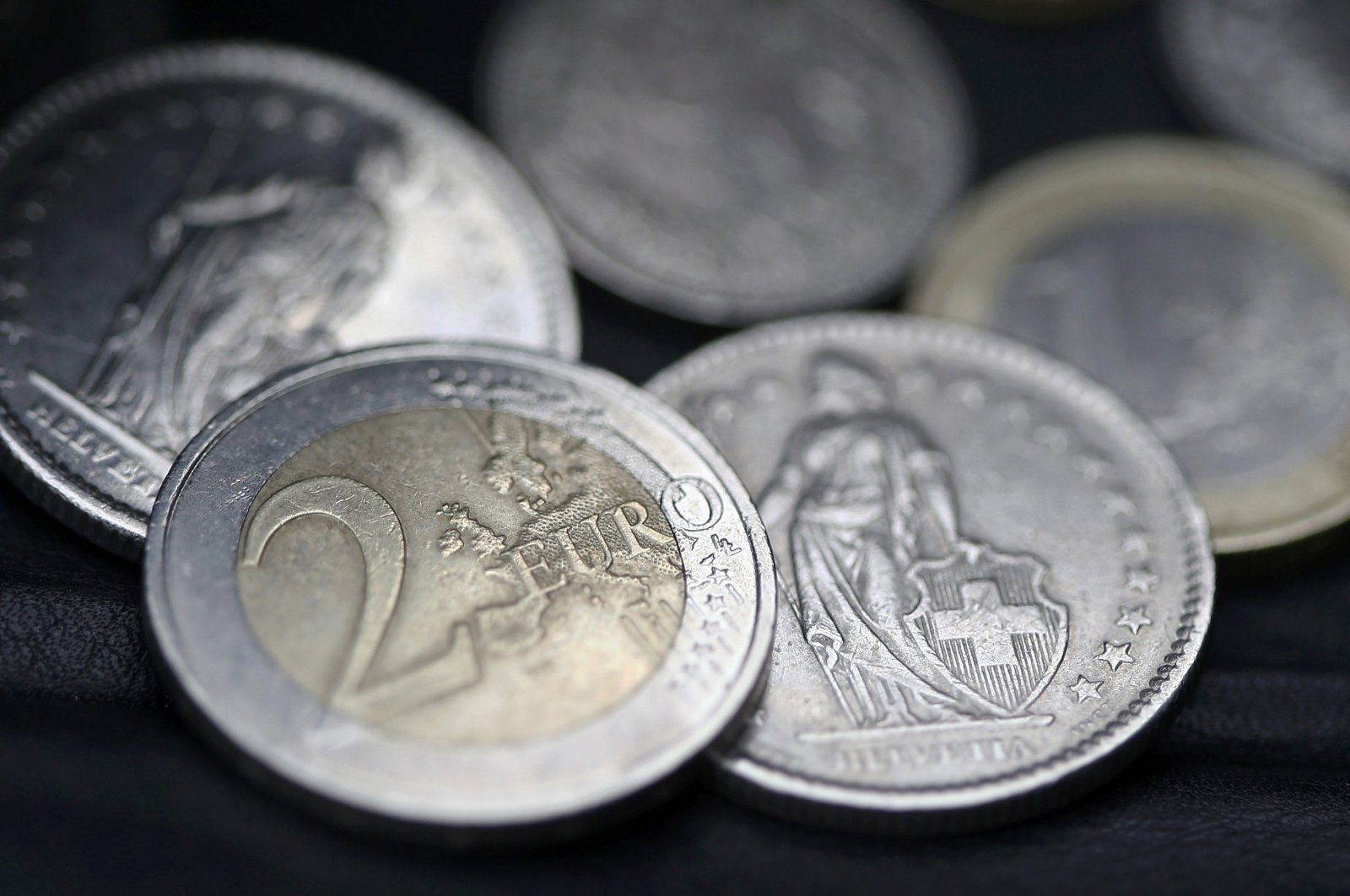 Euro and Swiss franc coins are seen in this photo in Bern, Switzerland, Jan. 16, 2015. (Reuters Photo)