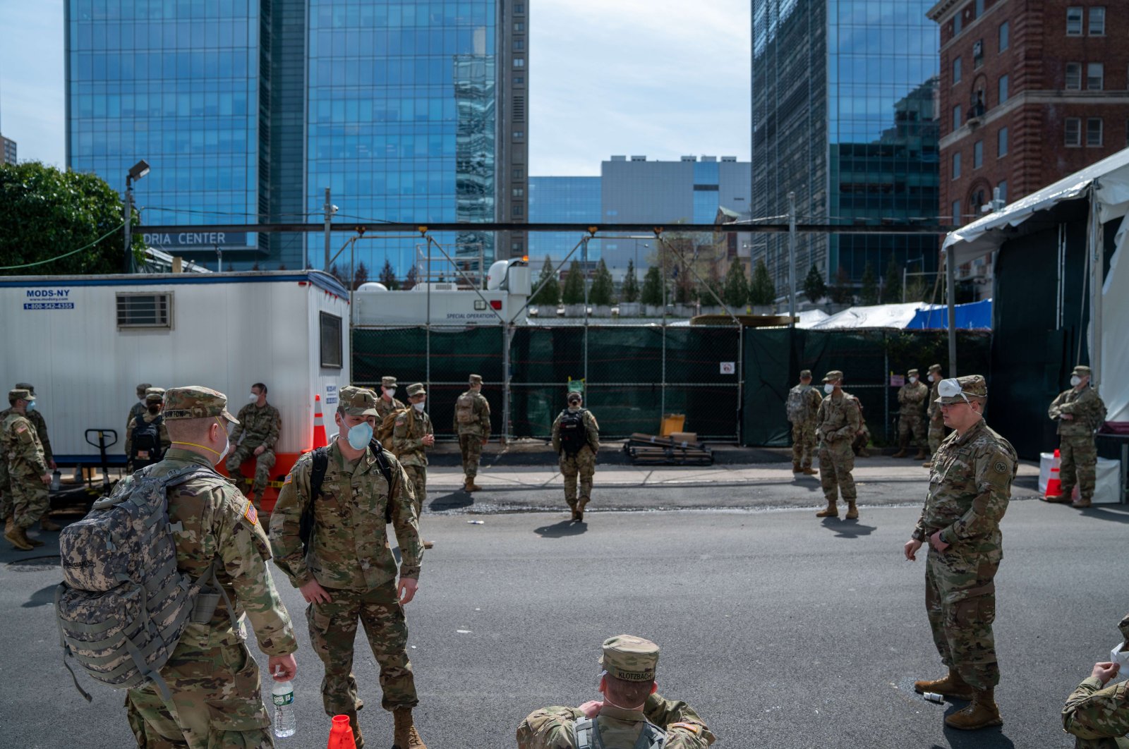 A group of soldiers on a side street behind the medical examiners office, New York, April 7, 2020. (AFP Photo)