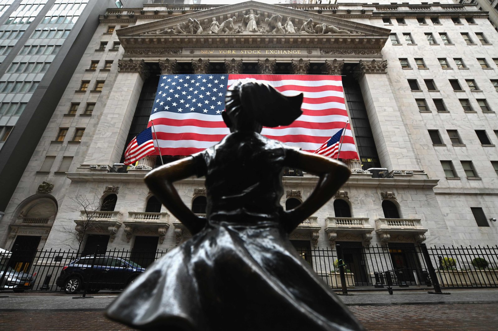 The Fearless Girl statue stands in front of the New York Stock Exchange near Wall Street in New York City, March 23, 2020. (AFP Photo)