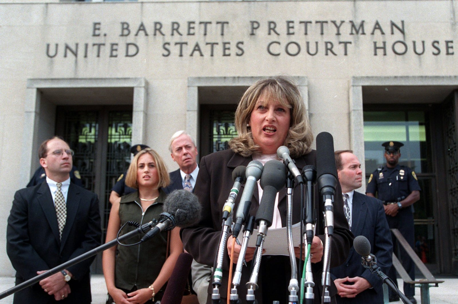 In this July 29, 1998, file photo Linda Tripp meets with reporters outside federal court in Washington after her final appearance before a grand jury investigating an alleged affair between President Bill Clinton and Monica Lewinsky. (AP Photo)