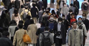 Commuters walk through Shibuya terminal station, Tokyo, Japan, April 8, 2020. (EPA Photo)