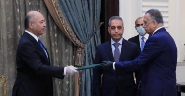 Iraq's President Barham Salih instructs newly appointed Prime Minister Mustafa al-Kadhimi, Baghdad, April 9, 2020. (REUTERS Photo)