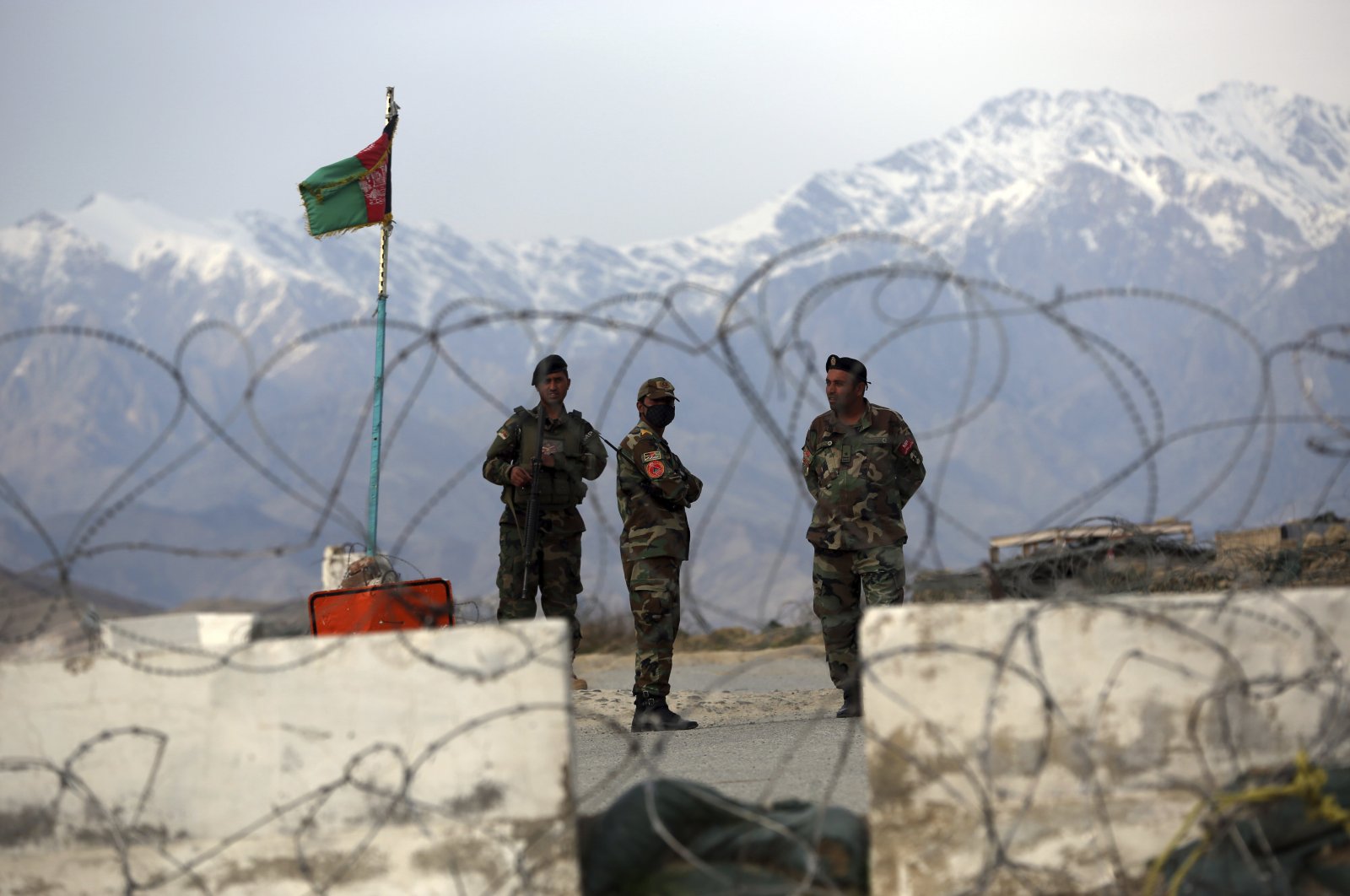 Afghan National Army soldiers stand guard at a checkpoint near the Bagram base in northern Kabul, Afghanistan, April 8, 2020. (AP Photo)