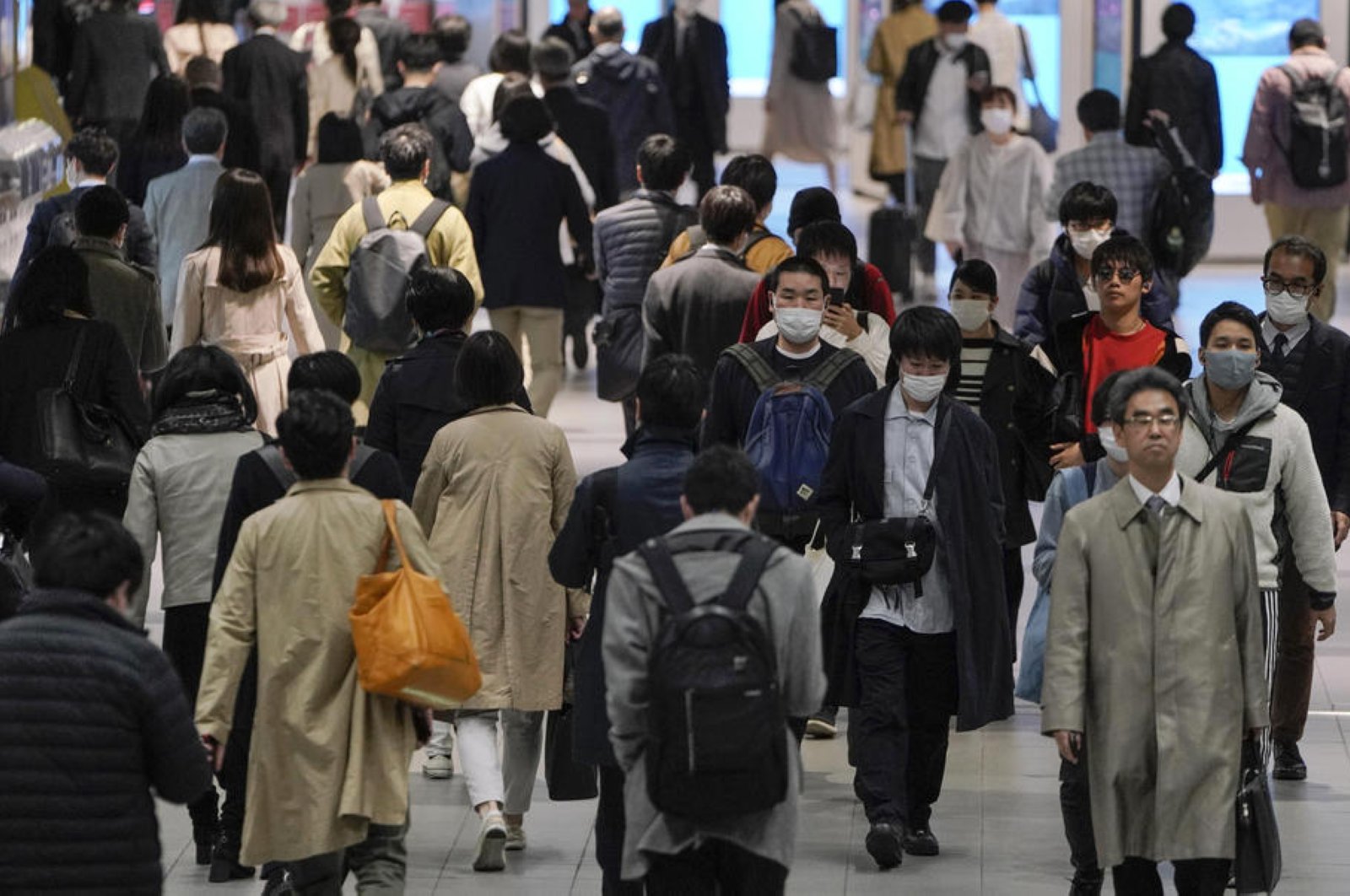 Commuters walk through Shibuya terminal station, Tokyo, Japan, April 8, 2020. (EPA Photo)