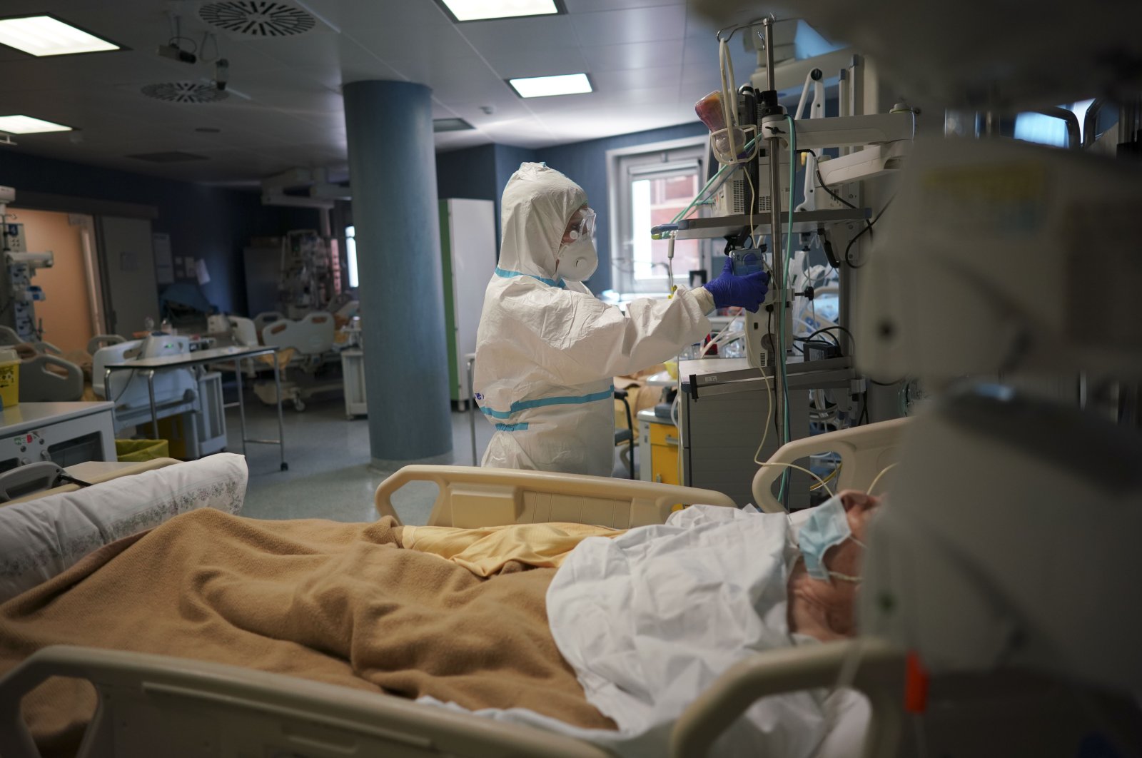 Medical staff tends to a patient in the ICU unit of San Filippo Neri Hospital's COVID-19 department, Rome, Italy, Thursday, April 9, 2020. (AP Photo)
