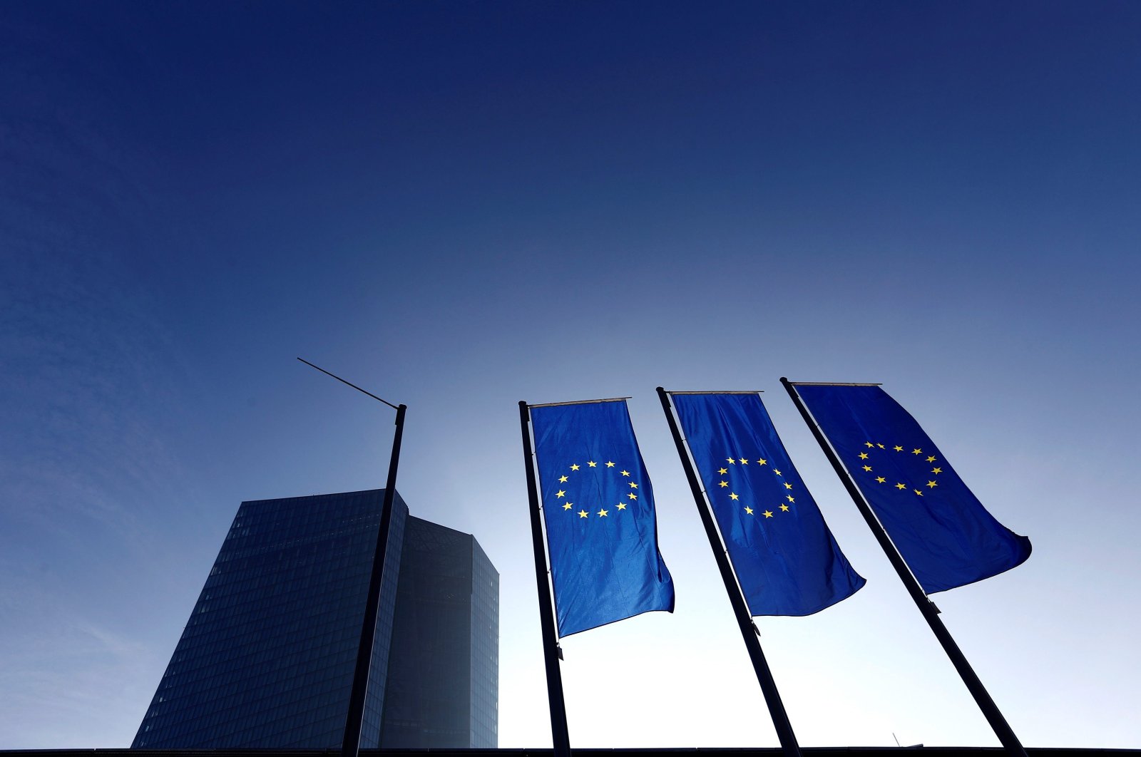 This undated photo shows EU flags outside the European Central Bank (ECB) headquarters, Frankfurt, Germany. (REUTERS Photo)