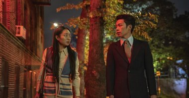 In this image released by Netflix, Kunjue Li (L) and Hong Chi appear in a scene from "Tigertail." (AP Photo)