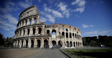 A man pedals outside Rome's ancient Colosseum, empty due to measures to prevent the spread of COVID-19, April 2, 2020. (AP Photo)