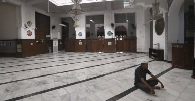 A man prays at an empty mosque in Jakarta, Indonesia, April 10, 2020. (AP Photo)