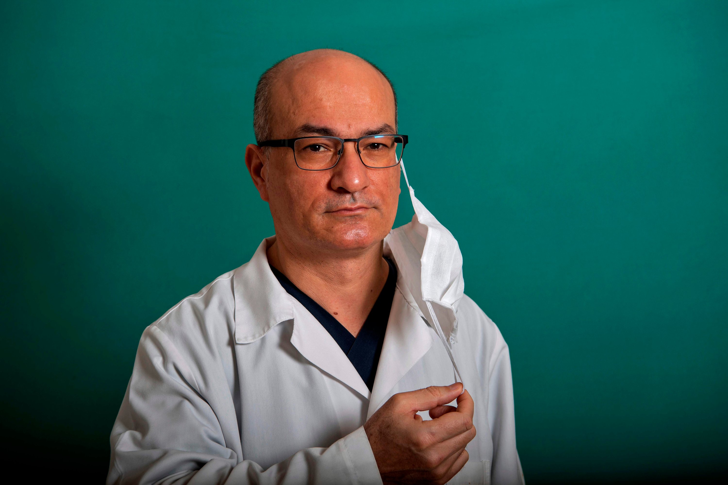 Associate professor and chief of the Cerrahpaşa Hospital Zekayi Kutlubay, 49, who has been working for twenty year as a registered doctor and treats COVID-19 patients, poses during a photo session.