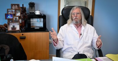 In this file photo taken on Feb. 26, 2020, French professor Didier Raoult, biologist and professor of microbiology, specialized in infectious diseases and director of IHU Mediterranee Infection Institute poses in his office in Marseille, southeastern France. (AFP Photo)
