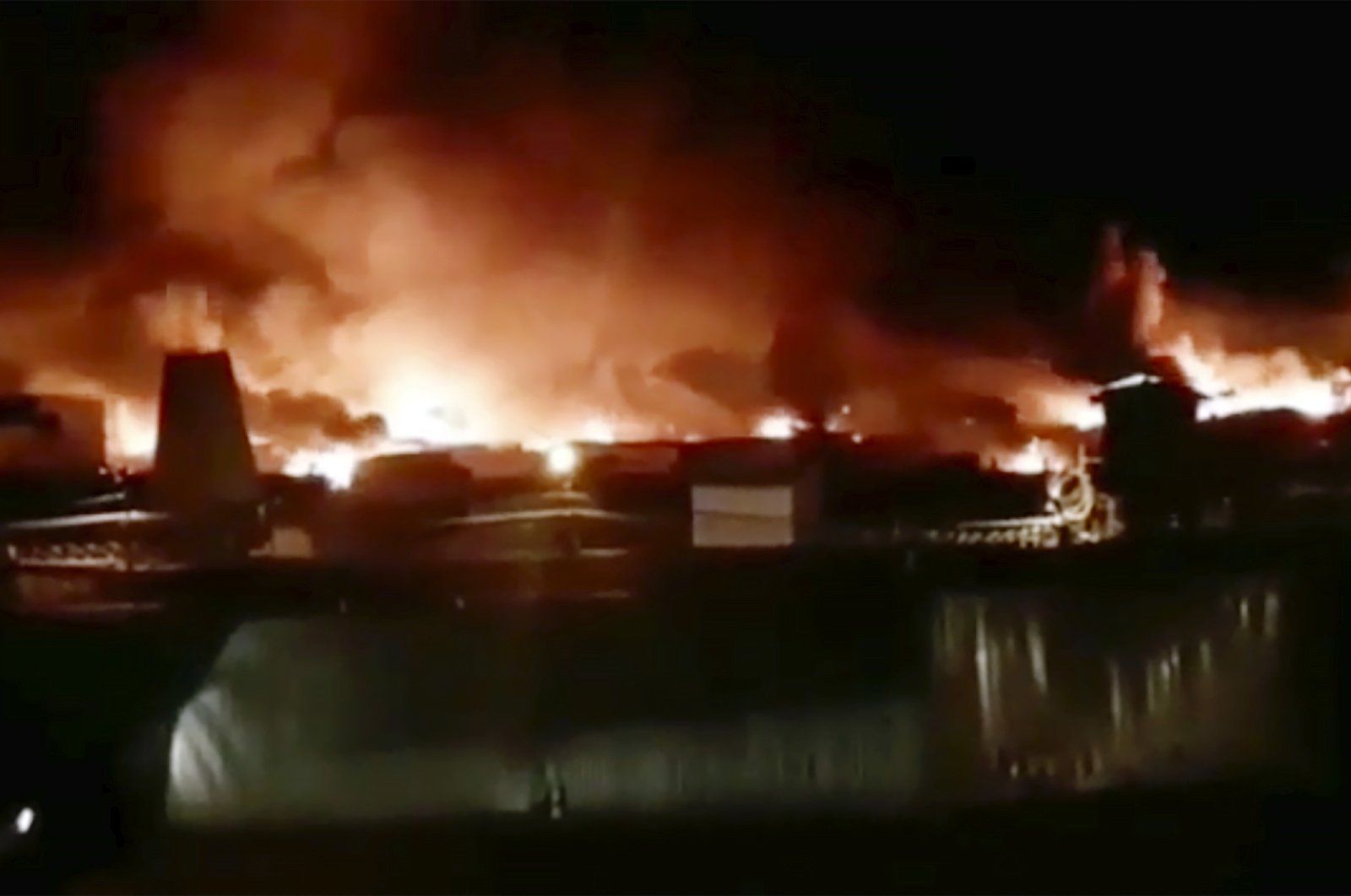 In this image taken from video provided by Instagram account @incident.38, a fire is blazing at a prison colony where inmates and guards have clashed in Angarsk, 4,000 kilometers (2,500 miles) east of Moscow, Friday, April 10, 2020. Russian officials say a large fire is blazing at a prison in Siberia where inmates and guards have clashed. There was no official information about casualties or damage Friday, but Pavel Glushenko, a local human rights activist, said on social media that “full-scale hostilities” were taking place at the maximum-security prison. (AP Photo)