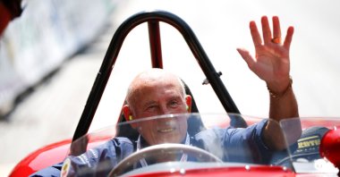 Stirling Moss waves to spectators as he sits in his 1955 Ferrari 750 Monza during the Ennstal Classic rally near the  village of Groebming, Austria,  July 20, 2013. (REUTERS Photo) 